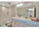 A well-lit bathroom features a large mirror, modern vanity with LED lighting, and a clean, tiled shower/tub combo at 10945 Sundrift Dr, Tampa, FL 33647