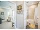 Bathroom featuring a shower-tub combo adjacent to the primary bedroom at 10945 Sundrift Dr, Tampa, FL 33647