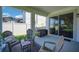 Cozy covered patio with outdoor seating and a grill, perfect for entertaining or relaxing outside at 10945 Sundrift Dr, Tampa, FL 33647