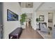 Inviting foyer features hardwood floors, high ceilings, and access to staircase at 10945 Sundrift Dr, Tampa, FL 33647