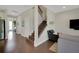 Entry hallway with hardwood floors and stairs to the upper level at 10945 Sundrift Dr, Tampa, FL 33647
