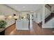 Spacious kitchen with stainless appliances, white cabinets, and hardwood floors at 10945 Sundrift Dr, Tampa, FL 33647