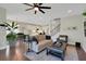 Comfortable living room with open layout connecting to the dining area and modern kitchen at 10945 Sundrift Dr, Tampa, FL 33647