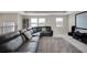 Spacious carpeted loft area features a large couch and plenty of bright, natural light at 10945 Sundrift Dr, Tampa, FL 33647