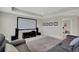 This loft features a large movie screen for entertainment, comfortable seating, and plush carpeting at 10945 Sundrift Dr, Tampa, FL 33647