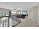 This upper loft area overlooks the foyer and provides ample space for entertaining at 10945 Sundrift Dr, Tampa, FL 33647