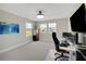 A bright office features ample windows, neutral walls, and modern furnishings, creating a comfortable workspace at 10945 Sundrift Dr, Tampa, FL 33647