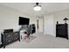 A large office features neutral walls, built-in shelving, and modern furnishings, creating a comfortable workspace at 10945 Sundrift Dr, Tampa, FL 33647
