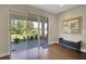Bright sunroom with large sliding doors and access to the outdoors at 10945 Sundrift Dr, Tampa, FL 33647