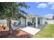 Scenic view of the backyard with a covered patio, perfect for outdoor enjoyment and entertaining at 1106 Humble Haven St, Ruskin, FL 33570