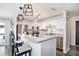 Bright kitchen features stainless steel appliances, granite countertops, breakfast bar with trendy pendant lighting at 1106 Humble Haven St, Ruskin, FL 33570