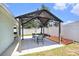 The covered patio features an outdoor dining set, creating an ideal space for entertaining and outdoor gatherings at 1106 Humble Haven St, Ruskin, FL 33570
