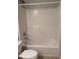 A standard bathroom featuring a white tiled shower and toilet at 11102 Summer Star Dr, Riverview, FL 33579