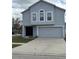 Two-story home with attached garage, neutral paint and manicured lawn provides great curb appeal at 11102 Summer Star Dr, Riverview, FL 33579