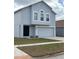 Two-story home with attached garage, neutral paint and manicured lawn provides great curb appeal at 11102 Summer Star Dr, Riverview, FL 33579
