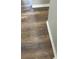 Close-up of wood-look flooring, highlighting the texture and color variation at 11102 Summer Star Dr, Riverview, FL 33579