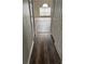 Hallway featuring new floors and neutral paint leads to living areas with natural light at 11102 Summer Star Dr, Riverview, FL 33579