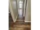 Neutral hallway features wood flooring and doorways that enhance the home's design at 11102 Summer Star Dr, Riverview, FL 33579