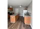 Bright kitchen featuring wood cabinets, granite countertops, a central island, and stainless steel appliances at 11102 Summer Star Dr, Riverview, FL 33579