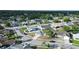 A beautiful aerial view of a residential neighborhood with well-maintained homes and mature trees at 11305 Brown Bear Ln, Port Richey, FL 34668