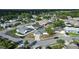 Scenic aerial view of a residential neighborhood with well-maintained homes and mature trees at 11305 Brown Bear Ln, Port Richey, FL 34668