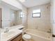 Cozy bathroom with a bathtub and window providing natural light, perfect for relaxation and comfort at 11305 Brown Bear Ln, Port Richey, FL 34668
