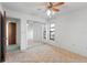 Bright bedroom offers mirrored closet doors and neutral carpet providing a relaxing atmosphere at 11305 Brown Bear Ln, Port Richey, FL 34668