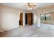 Bright bedroom with mirrored closets and neutral tones, creating a calming and inviting space at 11305 Brown Bear Ln, Port Richey, FL 34668