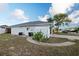 Exterior view of a well-maintained home with mature landscaping and clear signage at 11305 Brown Bear Ln, Port Richey, FL 34668