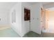 Bright hallway with clean lines, offering a welcoming entrance and smooth transition throughout the home at 11305 Brown Bear Ln, Port Richey, FL 34668