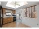 Well-lit kitchen with a view to the adjacent dining area, great for casual meals and Gathering gatherings at 11305 Brown Bear Ln, Port Richey, FL 34668
