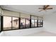 Enclosed porch is surrounded by windows offering a sun-filled area with lots of natural light at 11305 Brown Bear Ln, Port Richey, FL 34668