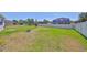 Spacious backyard with well-maintained lawn and fire pit, ideal for entertaining and relaxation at 11408 Coventry Grove Cir, Lithia, FL 33547