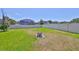Expansive backyard featuring lush green grass and a fire pit, perfect for outdoor enjoyment at 11408 Coventry Grove Cir, Lithia, FL 33547