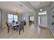 Open-concept dining room showcasing a stylish table setting and seamless flow to other living areas at 11408 Coventry Grove Cir, Lithia, FL 33547