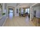 Elegant dining area with a large table set for a meal and open access to living spaces at 11408 Coventry Grove Cir, Lithia, FL 33547