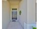 Welcoming entryway featuring a classic front door and neutral-toned exterior at 11408 Coventry Grove Cir, Lithia, FL 33547