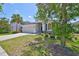 Charming residence offering well-maintained landscaping, a spacious driveway, and an attached two-car garage at 11408 Coventry Grove Cir, Lithia, FL 33547