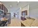 Well-equipped kitchen features stainless steel appliances, granite countertops, and dark wood cabinetry at 11408 Coventry Grove Cir, Lithia, FL 33547