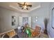 Office space with a wooden ceiling fan, modern decor, sleek furniture, and double doors leading to another room at 11408 Coventry Grove Cir, Lithia, FL 33547