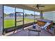 Screened patio with a view of the fenced yard and a seating area, featuring a hot tub at 11408 Coventry Grove Cir, Lithia, FL 33547