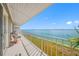 Spacious balcony offering serene water views and comfortable seating area at 1351 Gulf Blvd # 209, Clearwater Beach, FL 33767