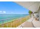 Waterfront balcony with seating offers serene ocean views and a relaxing outdoor space at 1351 Gulf Blvd # 209, Clearwater Beach, FL 33767