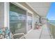 Inviting balcony with seating and stunning waterfront views at 1351 Gulf Blvd # 209, Clearwater Beach, FL 33767