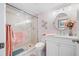 Elegant bathroom featuring a glass-enclosed shower and stylish vanity at 1351 Gulf Blvd # 209, Clearwater Beach, FL 33767