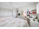 Light bedroom with twin beds, closet, and a convenient desk area at 1351 Gulf Blvd # 209, Clearwater Beach, FL 33767