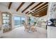 Dining area featuring waterfront views and glass slider access to the balcony at 1351 Gulf Blvd # 209, Clearwater Beach, FL 33767