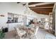 Bright open dining space with beamed ceilings open to the kitchen and living spaces at 1351 Gulf Blvd # 209, Clearwater Beach, FL 33767