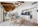 Bright open dining and kitchen space with beamed ceilings and water views at 1351 Gulf Blvd # 209, Clearwater Beach, FL 33767