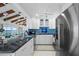 Kitchen with granite counters, white cabinets, and stainless appliances at 1351 Gulf Blvd # 209, Clearwater Beach, FL 33767